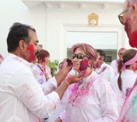 Daubing colours on each other, is Holi