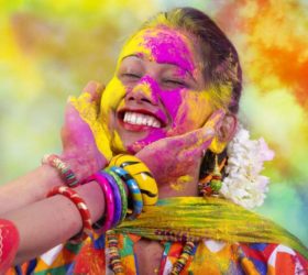 Portrait of  young Indian Woman celebrating Holi color festival